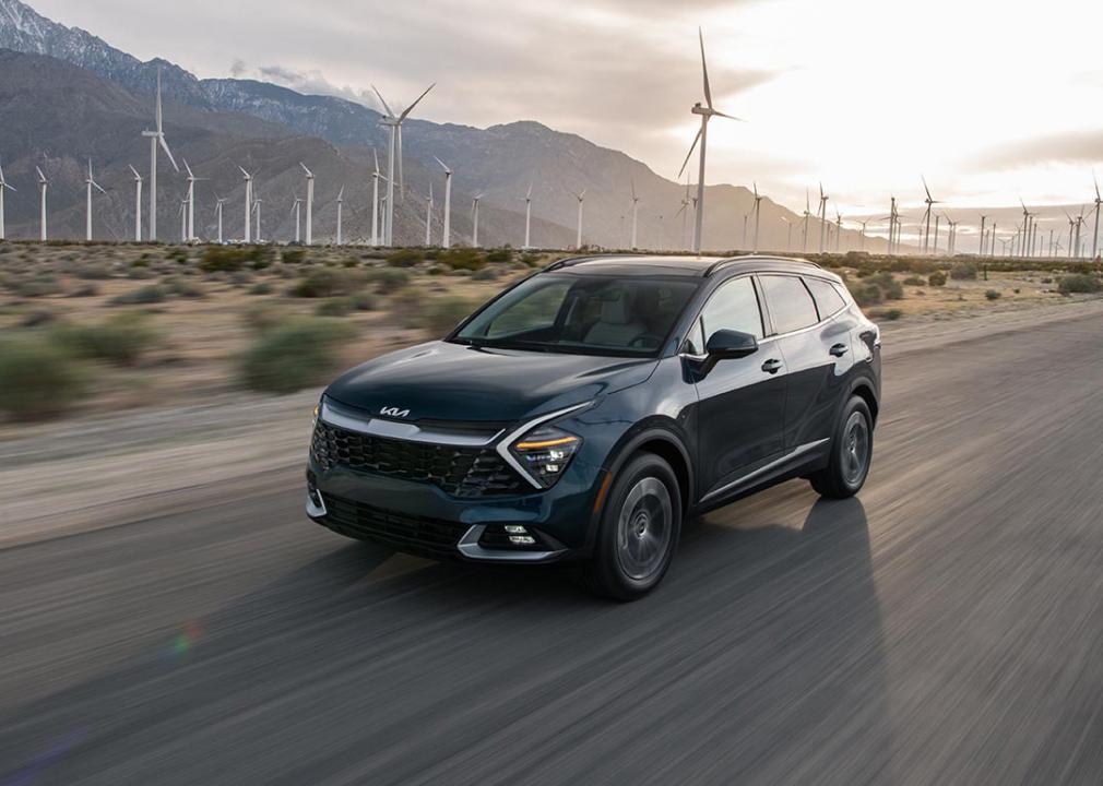 A black 2025 Kia Sportage Hybrid on the road.